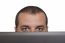 Man Peeking Over Laptop