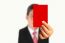 Businessman Showing Red Paper