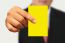 Businessman Showing Yellow Paper