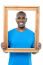 Smiling Guy Looking Through Picture Frame