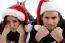 Close Up View Of Young Couple Wearing Christmas Hat And Looking At Camera