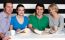 Family Enjoying Dinner At A Restaurant