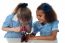 Little Girls Looking Into Microscope