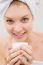 Close-up Of Smiling Woman In Spa Holding Cup