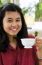 Young Woman Sipping Tea From A Cup