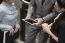 Hands Of A Casual Man Holding A Digital Tablet