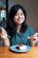 Smiling Young Woman With A Cake