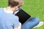 Boy With Crossed Legs Relaxing Outdoors