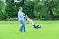 Playful Father And Daughter Having Fun In Garden