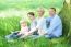 Cheerful Family Resting Under Tree