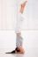 Young Woman Doing Yoga Headstand Pose