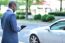 Back View Of African Man Holding Tablet