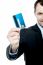 Smiling Businessman Holding Credit Card