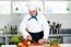 Chef Carefully Chopping Vegetables