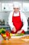 Chef Chopping Vegetables In Kitchen