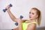 Active Beautiful Sports Girl Lifting Dumbbells Doing Workout In