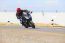 Young Man Riding Big Bike Motorcycle On Sharp Curve Asphalt Road