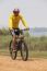 Young Man Wearing Rider Suit Riding Mountain Bike Mbt On Dusty R