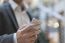 Businessman With Smartphone In Business Building