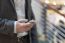 Businessman With Smartphone In Business Building