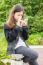 A Young Girl Using Smartphone In Park