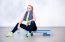 Fitness Woman Resting After Exercises In Gym