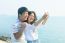 Young Man And Woman Take A Photo By Smart Phone At Sea Side Use