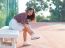 Portrait Of Beautiful Sport Girl Sitting In Tennis Courts  Looki