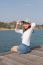 Portrait Of Beautiful Woman Happy Face Sitting On Wood Port Sea