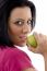 Side Pose Of Smiling Female Eating Apple