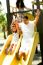 Kid Riding On Swing With Her Dad