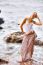 Beautiful Young Blonde Woman Posing Outdoor At The Rocky Sea Sho