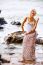 Beautiful Young Blonde Woman Posing Outdoor At The Rocky Sea Sho