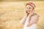 Lonely Beautiful Young Blonde Girl In White Dress With Straw Hat