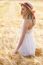 Lonely Beautiful Young Blonde Girl In White Dress With Straw Hat