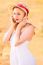 Lonely Beautiful Young Blonde Girl In White Dress With Straw Hat