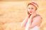 Lonely Beautiful Young Blonde Girl In White Dress With Straw Hat