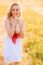 Lonely Beautiful Young Blonde Girl In White Dress With Straw Hat