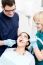 Dentist Examining A Woman Teeth