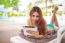 Woman Relaxing On Sunbed With Tablet