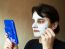 Beautiful Woman Gets Cosmetic Mask In The Mirror