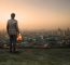 Engineering Man Standing On Top Of Building Looking To Urban Sce