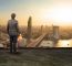 Engineering Man Standing On Top Of Building Looking To Urban Sce