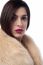 Stylish Young Woman In Fur Coat