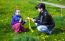 Mother Weaves A Wreath Of Dandelions For Her Daughter