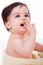 Baby With Finger In Mouth Looking Up