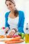 Pretty Young Woman Cooking At Home