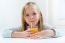 Beautiful Child Having Breakfast At Home