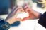 A Young Woman's Hands Making A Heart Shape