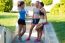 Group Of Young Women Doing Stretching In The Park